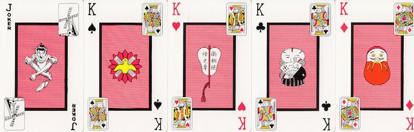 Five cards, one a joker and the other four being kings with various objects depicted.