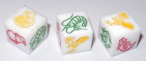 Three plastic dice with images of: tiger, gourd, prawn, rooster, crab, fish.