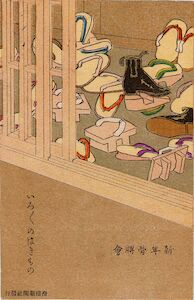 A pile of Japanese wooden sandles in the entrance-way to a house.