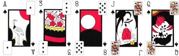 Five playing cards with the Hanafuda design in center and a corresponding Western card depicted in the corners that are not occupied by the card indices.