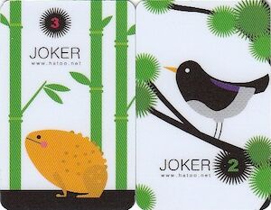 Two cards labelled ‘joker’, one with a frog and one with a black bird.