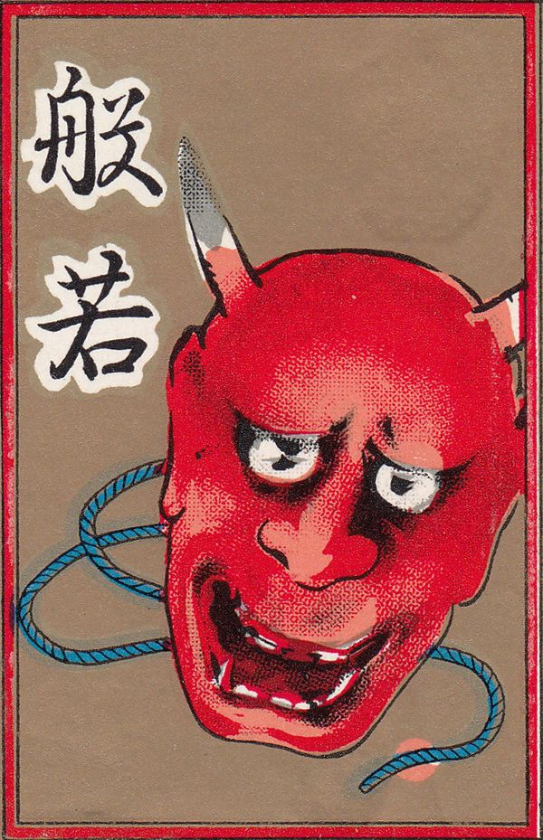 A hanafuda wrapper with an image of a horned mask.