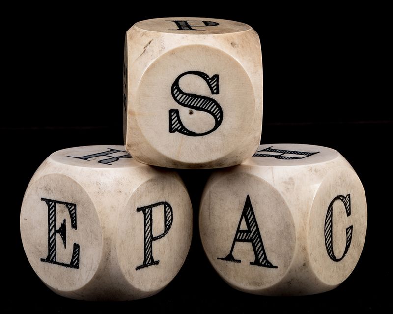 Three dice with the letters P A C E R S on them.