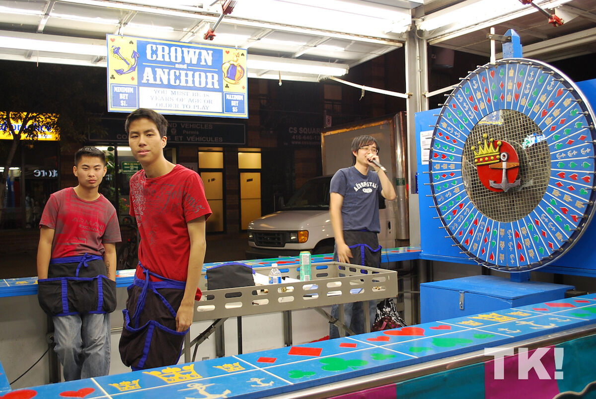 A Crown-and-Anchor wheel and staking board with proprietors.