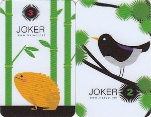 Two cards labelled ‘joker’, one with a frog and one with a black bird.