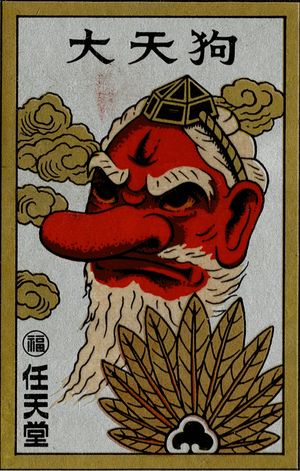 A Hanafuda wrapper with a red figure with a big nose, holding a fan made of feathers.
