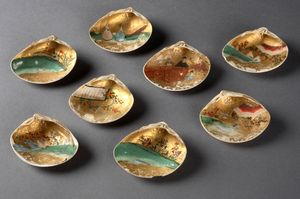 Eight shells whose interiors have been painted with garden scenes and ornamented with gold.