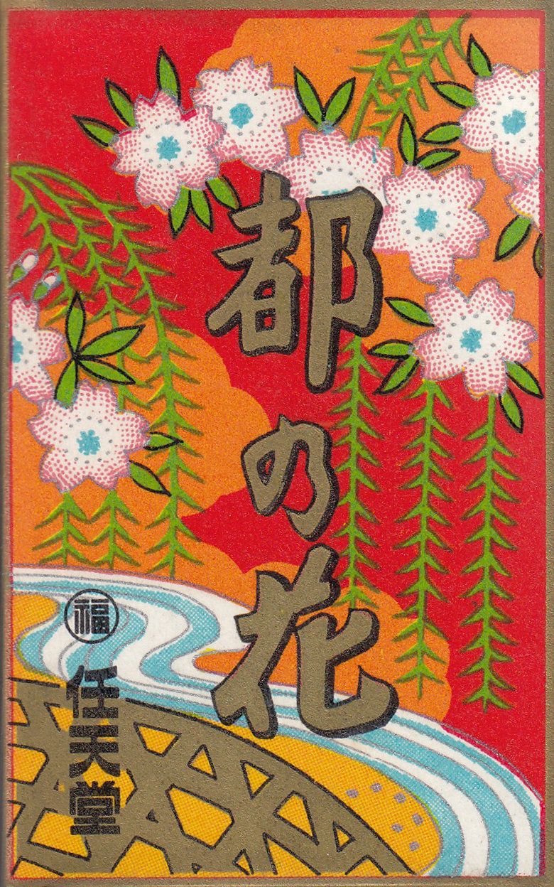 A Hanafuda wrapper with cherry blossoms and willow leaves hanging over a river.