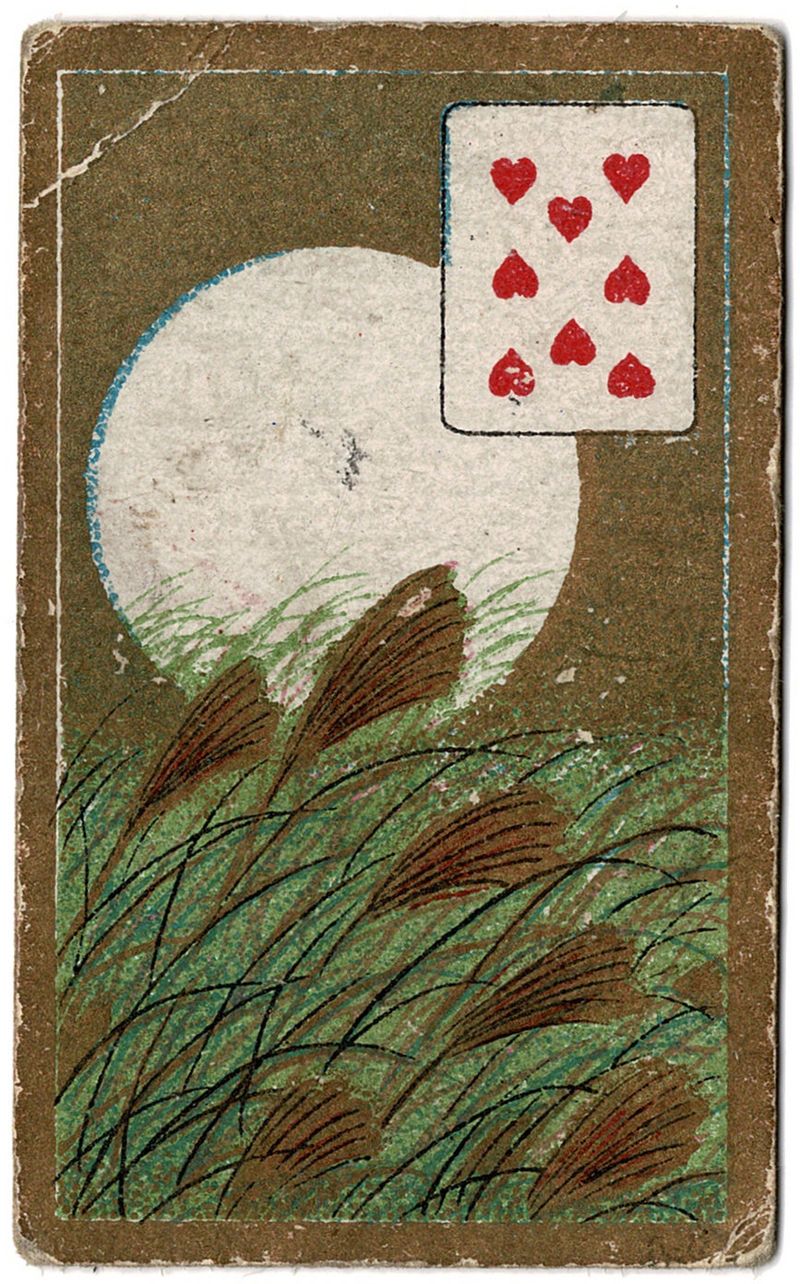 A tobacco card with the moon bright and the 8 of hearts.